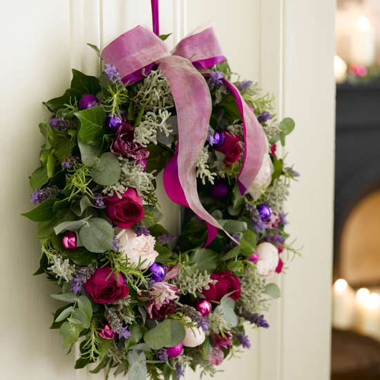 A fragrant Christmas wreath will delight guests before they step through the door