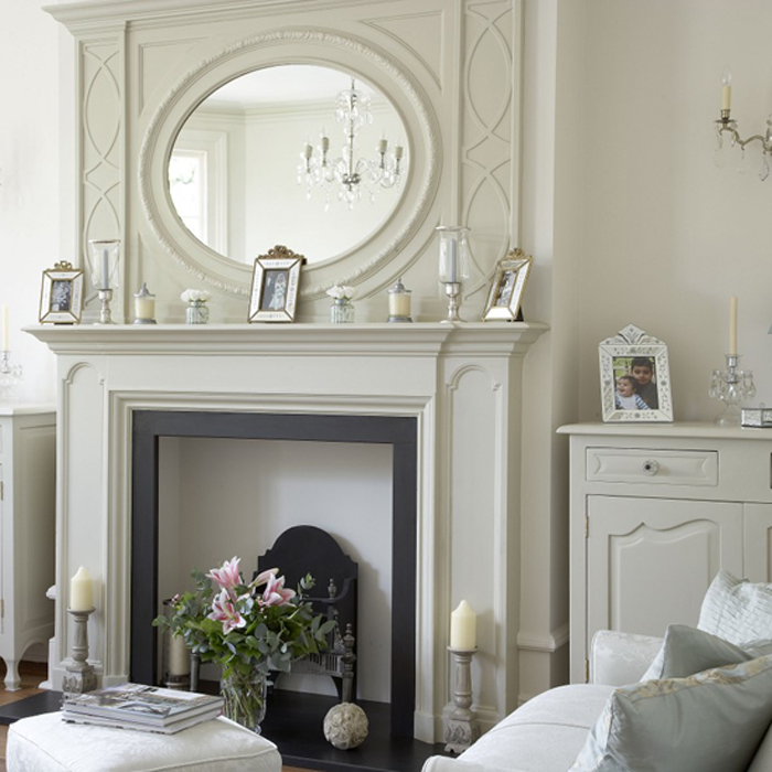 Living room with white fireplace