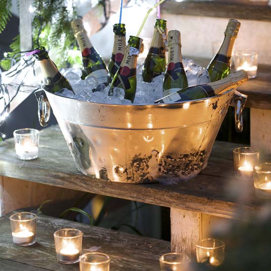 Serve mini champagne bottles from a giant ice bucket High-impact, low-effort Christmas decorating | Christmas decorating ideas | Christmas | PHOTO GALLERY | Livingetc