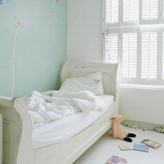 Decorative girl's bedroom with handpainted floral mural 