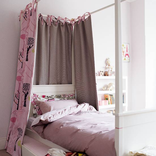 Girl'd bedroom with four-poster bed 
