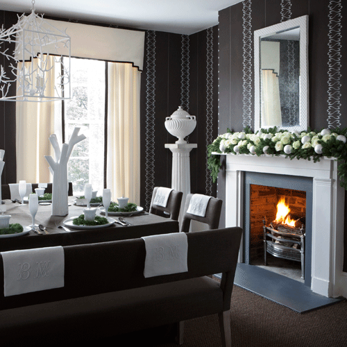 Black and white dining room with white fireplace and black wallpaper with stripe theme