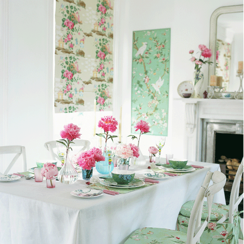 Dining room with green wallpaper panelled wall