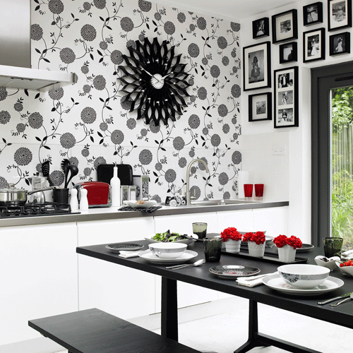 Monochrome kitchen-diner with floral wallpaper