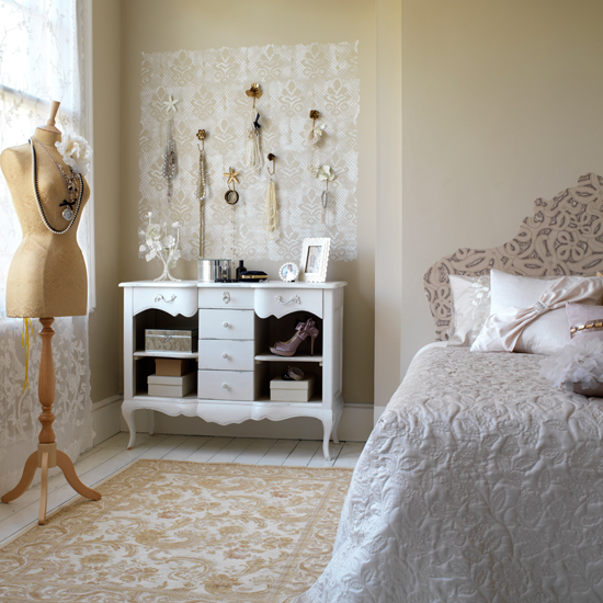 Bedroom with white chest of drawers and dress mannequin