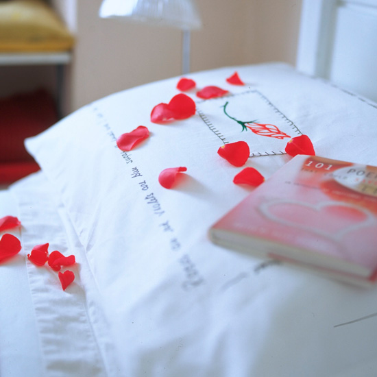 Rose petals on pillow | Create a romantic bedroom for Valentine's Day | Valentine's Day bedroom | PHOTO GALLERY
