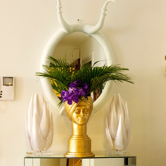 Surrealist hallway with white-horned mirror and gold head vase | Weird and wonderful hallways | Hallway decorating ideas | PHOTO GALLERY