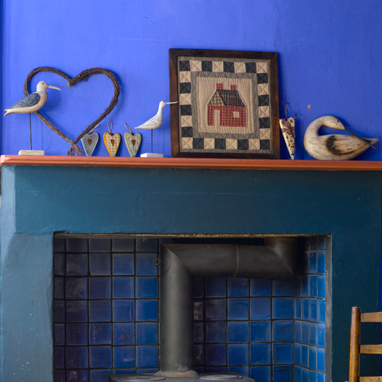 Display folk art pieces | Cosy fireplace ideas - 10 of the best | How to create a cosy fireplace | Fireplace design