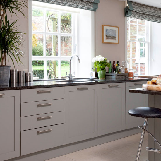 Timeless Kitchen Design Ideas timeless kitchen cabinets that never go out of style myungsebinnet Kitchen With Pale Wood Floor Soft Grey Units Black Granite Worktops And Black Bar Timeless Kitchen Design Ideas image of transitional kitchen design ideas Kitchen With Pale Wood Floor Soft Grey Units Black Granite Worktops And Black Bar