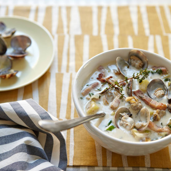 In New York, clam chowder is tomato-based, but the New England version is deliberately creamy 