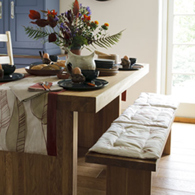Make two or three cushions, or a single long one, to fit your bench.