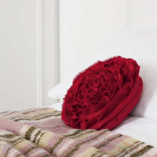 Use contrasting fabric for the ruffled 'petals', allowing the red background to peep through
