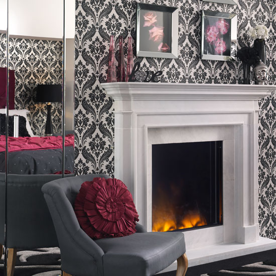 Mix mirrored furniture with monochrome wallpaper for a glam look