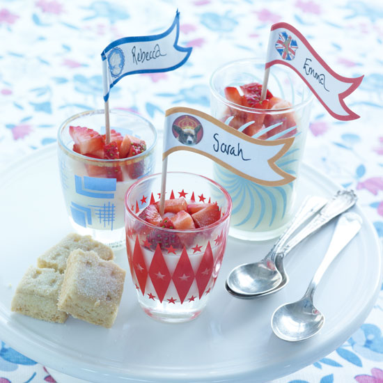 A traditional English cream and sugar-based dessert topped with a spoonful of fresh strawberry compote — summer in a pot.