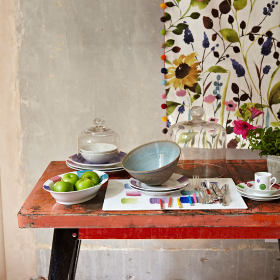 Arrange unique pieces of tableware Kitchen table with floral wall hanging | PHOTO GALLERY | Homes & Gardens | Housetohome.co.uk