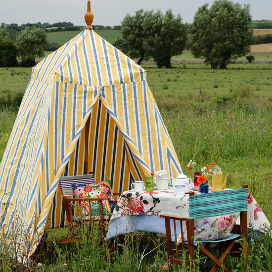 Picnic garden with striped tent 