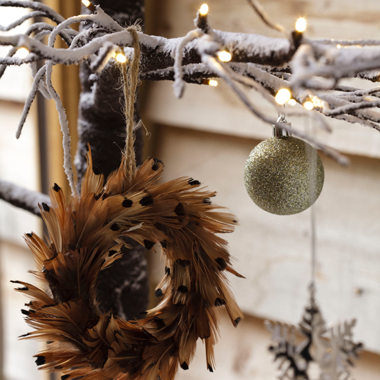 Wrap fairy lights around branches for woodland style Outdoor