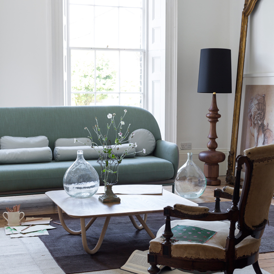Modern living room with mint green sofa