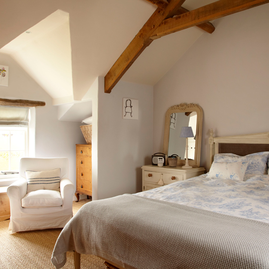 Cottage bedroom with wood beams