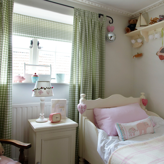 Country-style girl's bedroom with gingham curtains