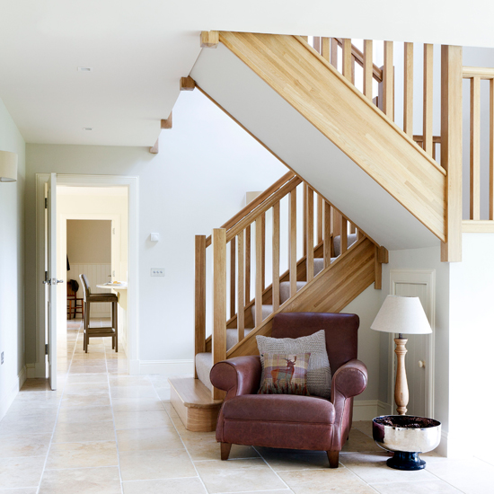 Open-plan hallway with limestone flooring