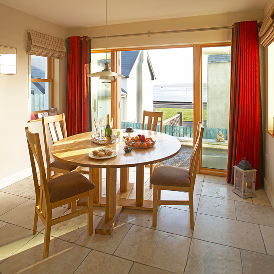 Neutral dining room with travertine floor
