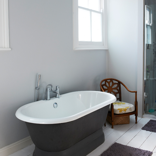 Charcoal and white bathroom with freestanding bath