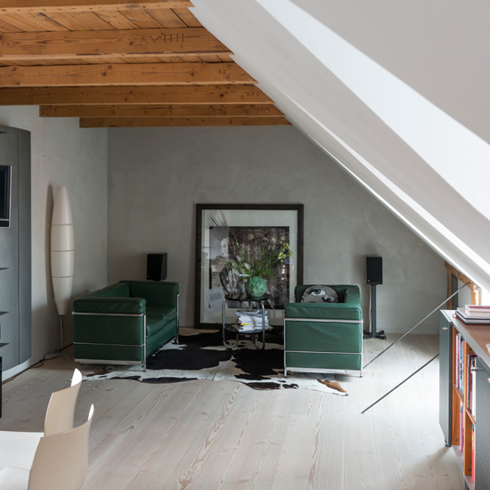 Modern living room with green sofas