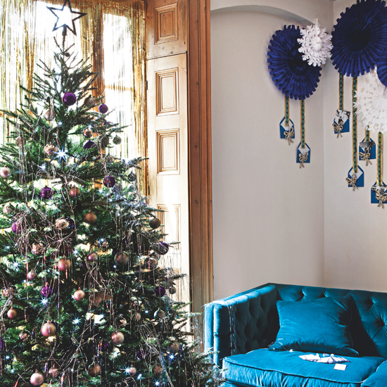 Living room with peacock blue sofa