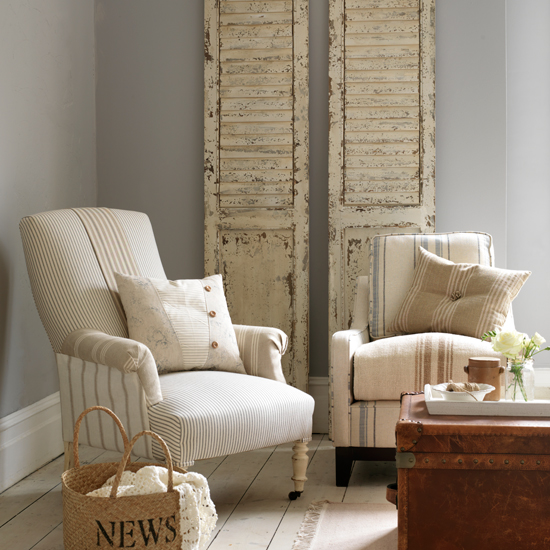 Neutral living room with ticking armchair