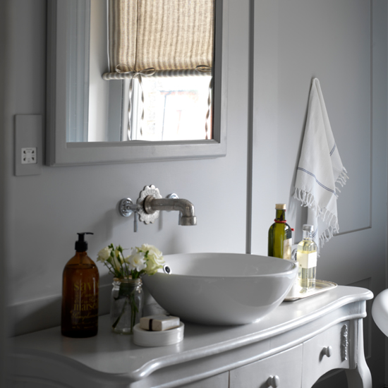 White bathroom with ticking blind