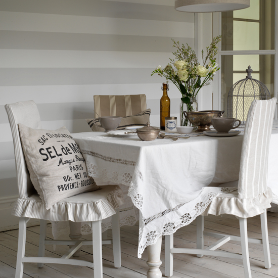 Neutral dining room with striped wallpaper