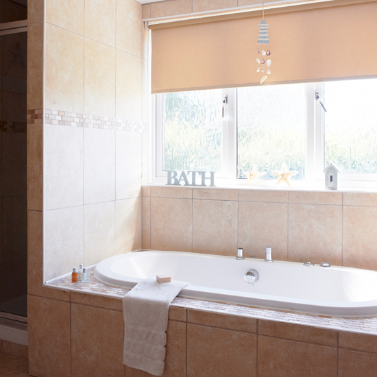 Travertine tiled bathroom 