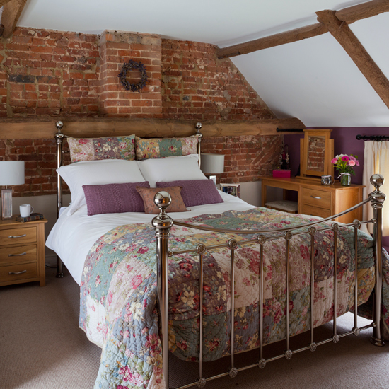 Bedroom with rustic brickwork