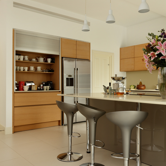 Grey kitchen with wooden cabinetry 