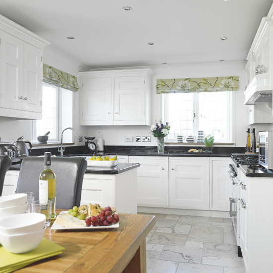 White Shaker kitchen with green accents