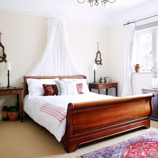 Calming white bedroom with sleigh bed