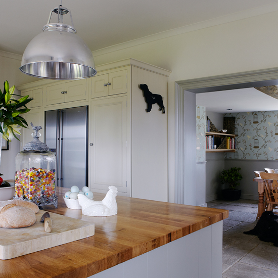 Grey-green Shaker kitchen with breakfast bar