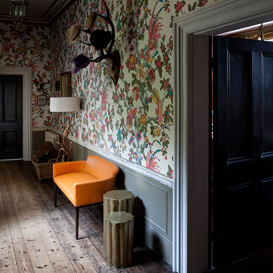Grand hallway with statement wallpaper