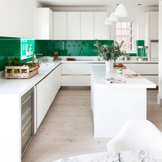 Vibrant green and white streamlined kitchen