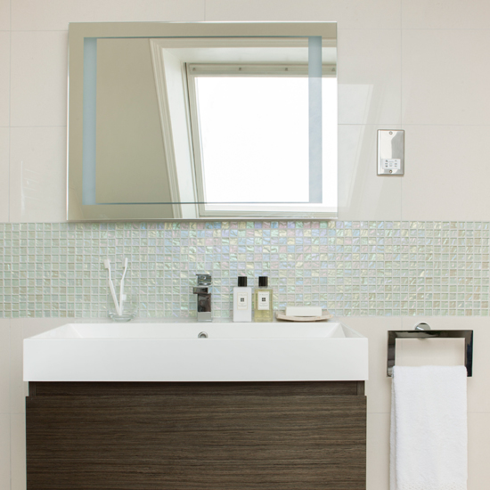 White mosaic tiled bathroom