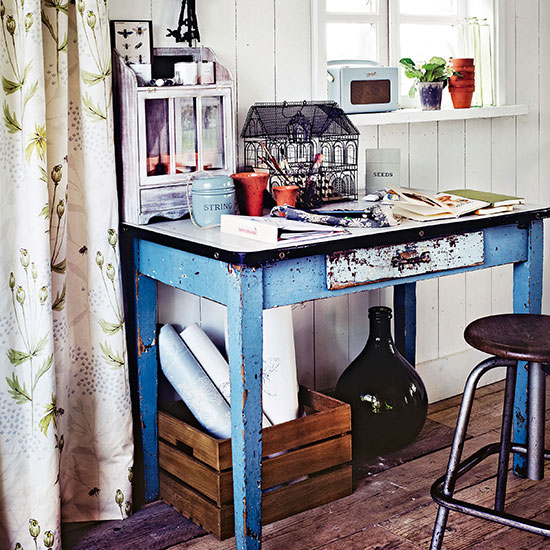 Conservatory with rustic blue table