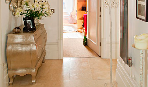 Travertine tiled hallway