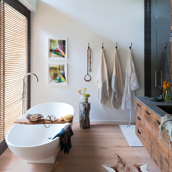 White nautical bathroom with rope blind