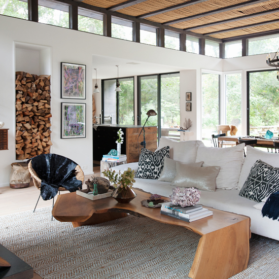 White open-plan living room with wooden furniture