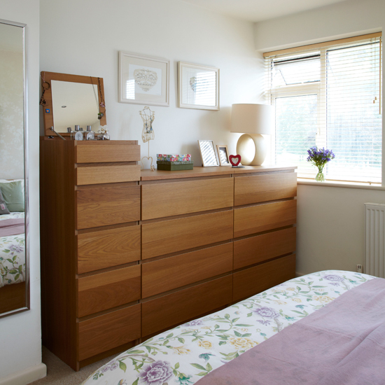 Cream bedroom with wooden storage