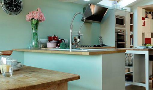 Pale green and oak kitchen