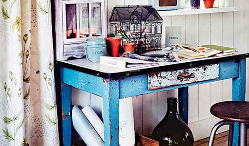 Conservatory with rustic blue table