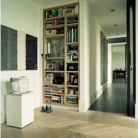 Minimal home office with tall bookcase
