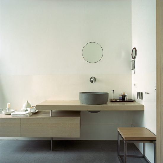 Minimal bathroom with streamlined cabinetry